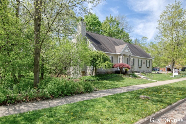 2658 Golfridge Dr SE, Grand Rapids, MI 49546 - view of front of property featuring a front yard and a chimney