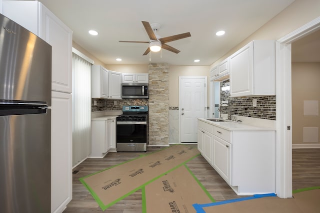 kitchen with light countertops, stainless steel appliances, backsplash, and ceiling fan