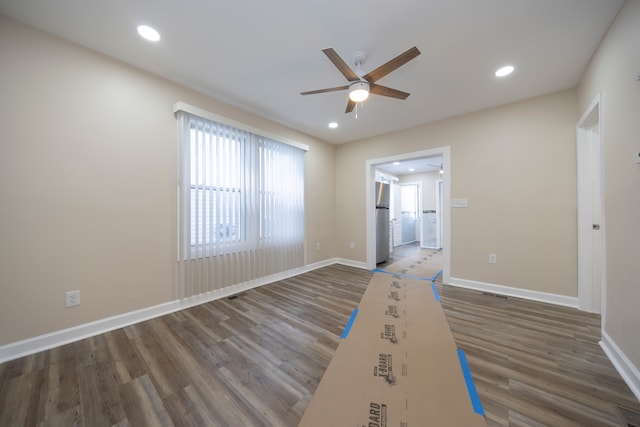 unfurnished room with baseboards, recessed lighting, wood finished floors, and ceiling fan