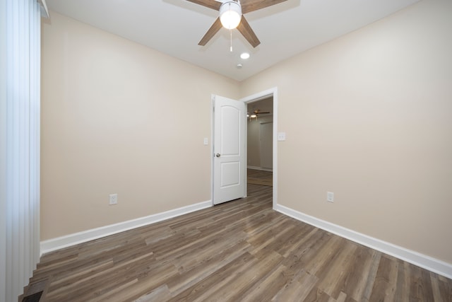 empty room with recessed lighting, wood finished floors, ceiling fan, baseboards, and visible vents