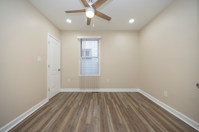 empty room featuring wood finished floors, ceiling fan, recessed lighting, and baseboards