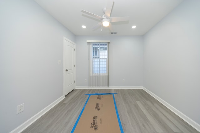 spare room with visible vents, baseboards, recessed lighting, wood finished floors, and a ceiling fan