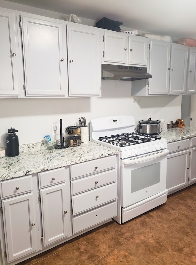 33 E Fairmount Ave, Pontiac, MI 48340 - kitchen featuring white cabinets, white range with gas cooktop, light stone counters, and under cabinet range hood