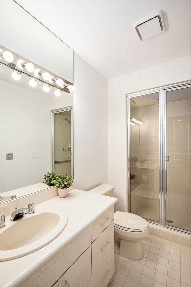 full bathroom with tile patterned flooring, toilet, vanity, visible vents, and a stall shower