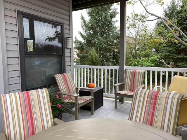 wooden deck with outdoor dining area