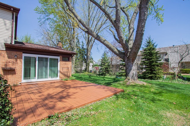view of yard featuring a wooden deck