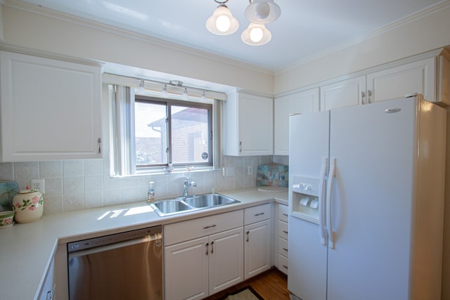 kitchen featuring dishwashing machine, white refrigerator with ice dispenser, white cabinetry, a chandelier, and a sink