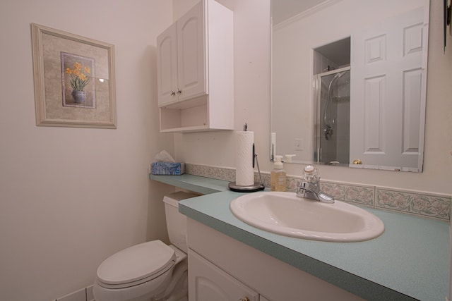 full bathroom with vanity, a stall shower, and toilet