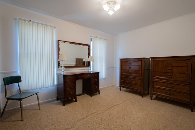 bedroom with crown molding, baseboards, and light colored carpet