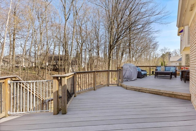 wooden terrace featuring outdoor lounge area