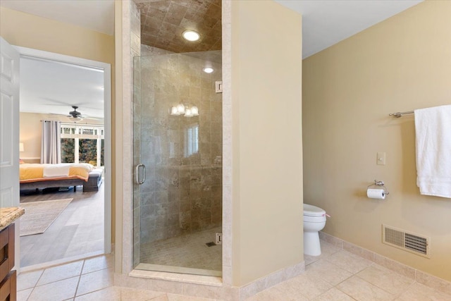 bathroom with tile patterned floors, visible vents, vanity, a stall shower, and ensuite bathroom