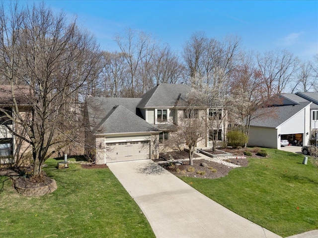 view of front facade featuring concrete driveway, a front lawn, and a garage