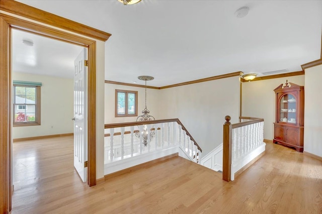2485 Kimberly Fair St, Rochester Hills, MI 48309 - hallway with an upstairs landing, light wood-style floors, plenty of natural light, ornamental molding, and baseboards