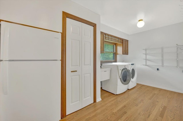 2485 Kimberly Fair St, Rochester Hills, MI 48309 - laundry room featuring independent washer and dryer and light wood-type flooring