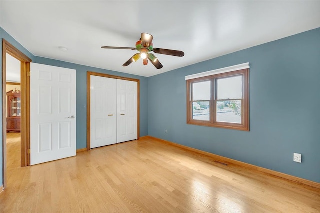 2485 Kimberly Fair St, Rochester Hills, MI 48309 - unfurnished bedroom with light wood-style floors, baseboards, a closet, and ceiling fan