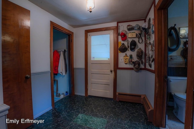 interior space with a wainscoted wall