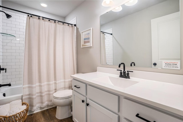 742 Ravine Ln, South Haven, MI 49090 - full bathroom featuring shower / tub combo with curtain, wood finished floors, toilet, and vanity