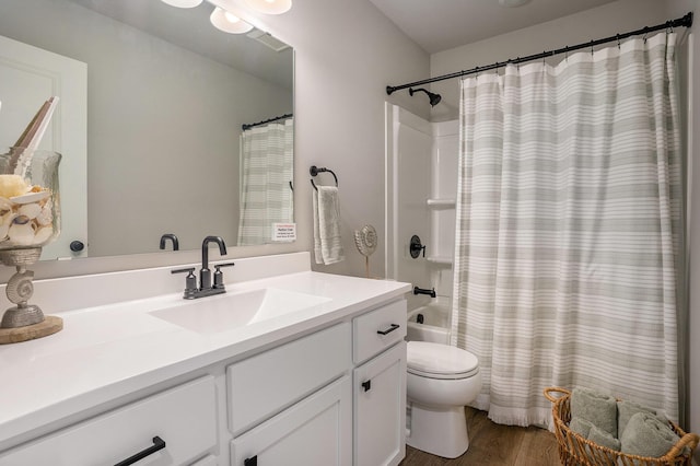 742 Ravine Ln, South Haven, MI 49090 - bathroom with shower / bath combination with curtain, wood finished floors, vanity, and toilet