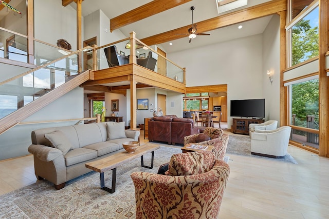 5788 M 63, Coloma, MI 49038 - living room with beam ceiling, a ceiling fan, and high vaulted ceiling