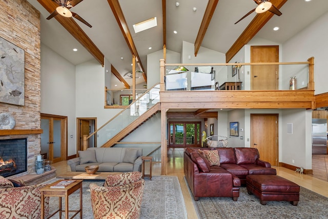 5788 M 63, Coloma, MI 49038 - living area featuring a stone fireplace, wood finished floors, high vaulted ceiling, and ceiling fan