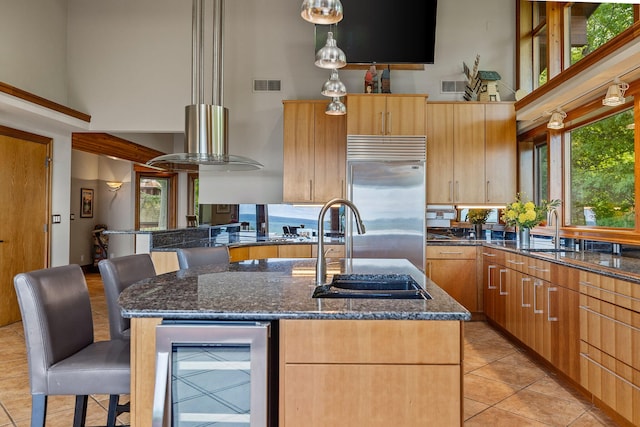 5788 M 63, Coloma, MI 49038 - kitchen featuring a high ceiling, wine cooler, visible vents, a sink, and stainless steel built in fridge