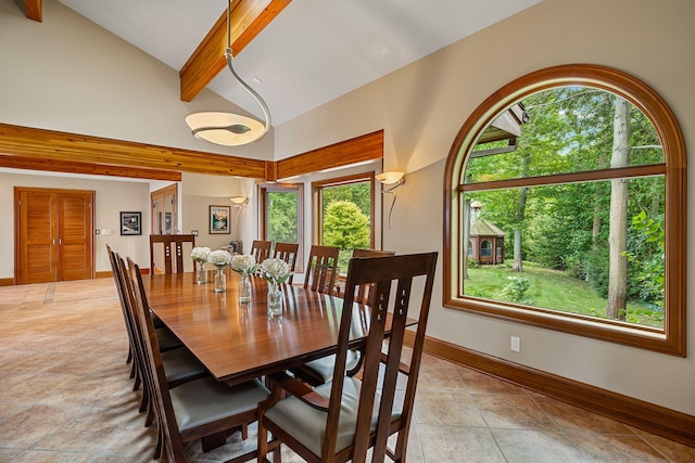 5788 M 63, Coloma, MI 49038 - dining area with lofted ceiling with beams, baseboards, and light tile patterned flooring