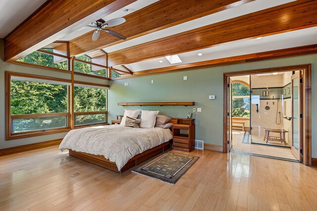 5788 M 63, Coloma, MI 49038 - bedroom featuring light wood-type flooring, baseboards, lofted ceiling with skylight, and visible vents