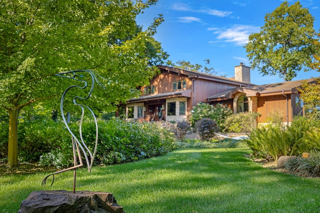 5788 M 63, Coloma, MI 49038 - exterior space featuring a lawn and a chimney