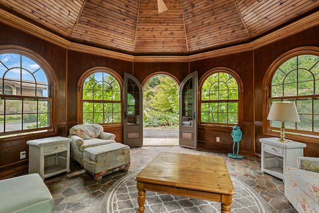 5788 M 63, Coloma, MI 49038 - living area featuring high vaulted ceiling, wood walls, and stone flooring