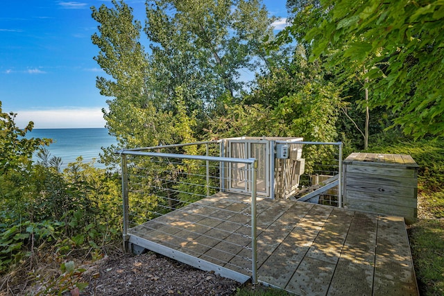 5788 M 63, Coloma, MI 49038 - wooden terrace with a water view, an outbuilding, and a storage shed
