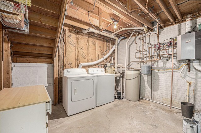 laundry room with washing machine and clothes dryer and laundry area