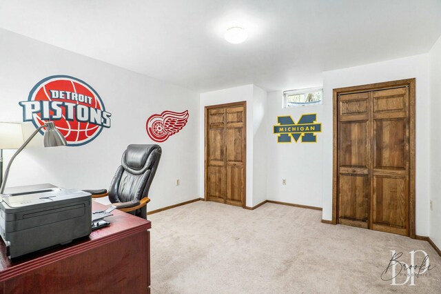 office with light carpet and baseboards