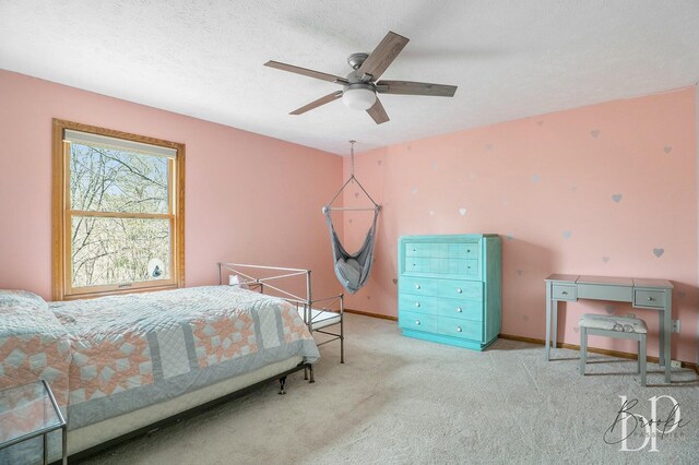 carpeted bedroom featuring baseboards