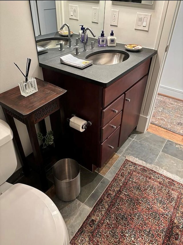 bathroom with vanity and toilet