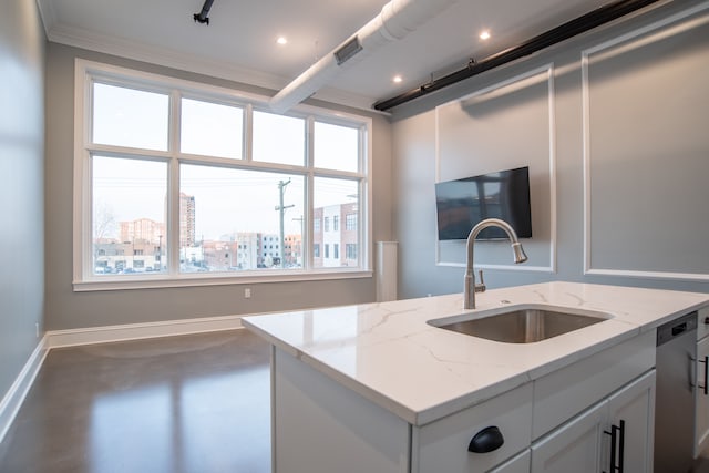 kitchen with stainless steel dishwasher, a sink, finished concrete flooring, baseboards, and light stone countertops