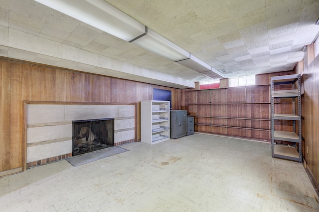 20 Oxford Blvd, Pleasant Ridge, MI 48069 - below grade area featuring wood walls, a fireplace with flush hearth, and light floors