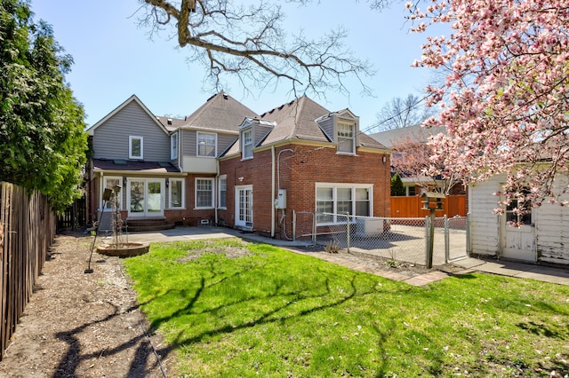 20 Oxford Blvd, Pleasant Ridge, MI 48069 - rear view of house featuring a yard, brick siding, a patio, and a fenced backyard