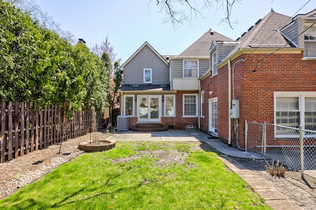 20 Oxford Blvd, Pleasant Ridge, MI 48069 - back of house with entry steps, a fenced backyard, and brick siding
