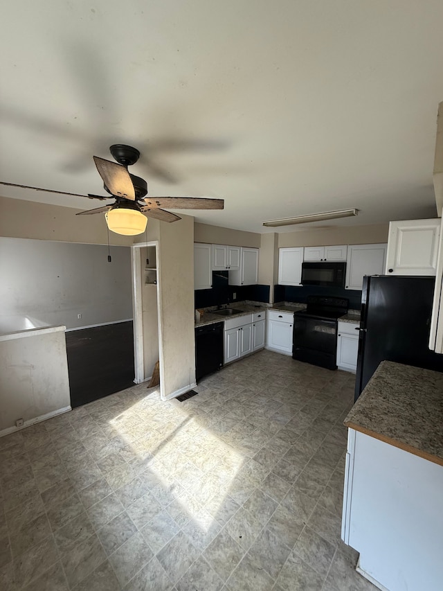 4123 Burton St, Inkster, MI 48141 - kitchen with black appliances, white cabinetry, a ceiling fan, and a sink