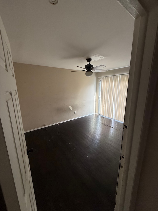 4123 Burton St, Inkster, MI 48141 - empty room with baseboards, wood finished floors, and ceiling fan