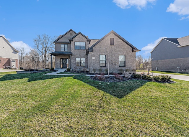 view of front of property with brick siding and a front lawn