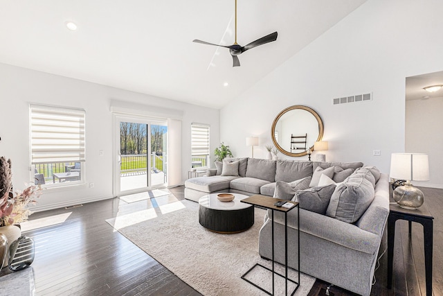 living area with visible vents, dark wood-style flooring, ceiling fan, high vaulted ceiling, and recessed lighting
