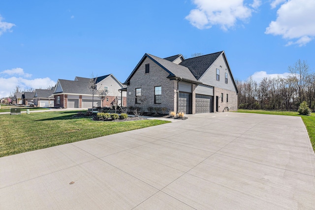 view of home's exterior featuring brick siding, a lawn, and concrete driveway