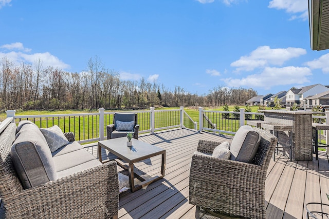 wooden terrace featuring a yard and an outdoor hangout area