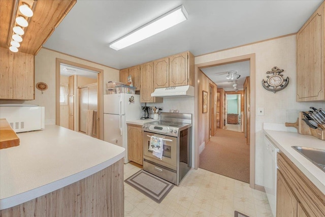 kitchen featuring under cabinet range hood, light brown cabinets, white appliances, light countertops, and light floors