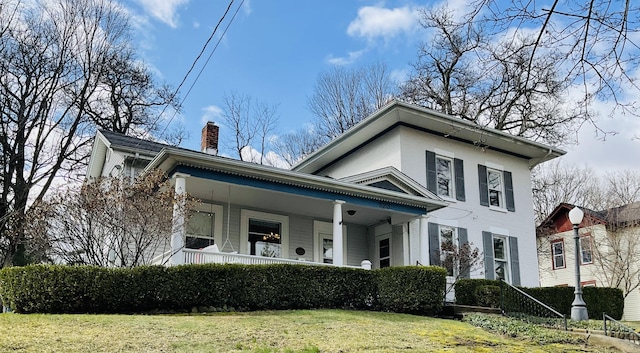 323 N Marshall Ave, Marshall, MI 49068 - greek revival house with a porch, a chimney, and a front yard
