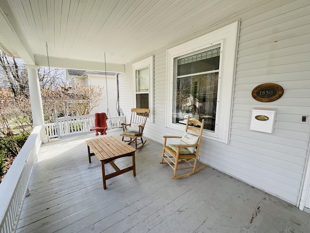 323 N Marshall Ave, Marshall, MI 49068 - deck featuring covered porch