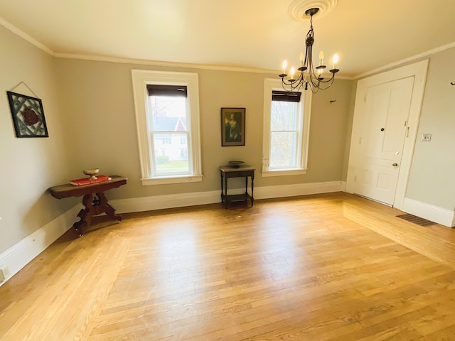 323 N Marshall Ave, Marshall, MI 49068 - unfurnished dining area featuring an inviting chandelier, light wood-style flooring, and plenty of natural light