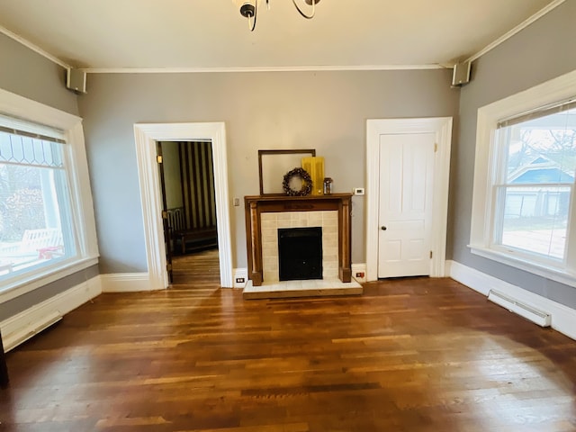 323 N Marshall Ave, Marshall, MI 49068 - unfurnished living room featuring wood finished floors, visible vents, a wealth of natural light, and ornamental molding