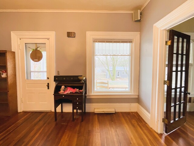 323 N Marshall Ave, Marshall, MI 49068 - entrance foyer with plenty of natural light, baseboards, dark wood-type flooring, and ornamental molding